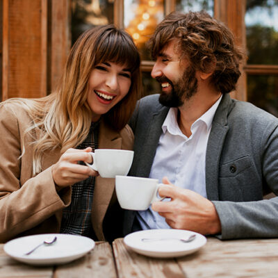 Laughing couple in love.  Handsome man with beard and his elegan